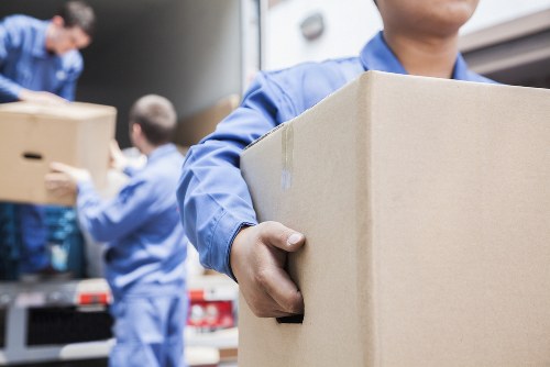 Local removals team handling a move in an Italian city street