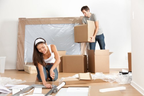 Furniture being loaded into a moving van in an Italian city