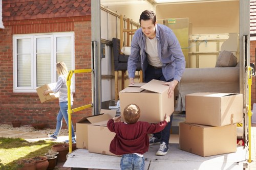 House removalists handling a move in an Italian city apartment building