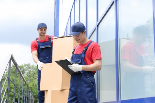 Local removal team handling apartment access in an Italian city