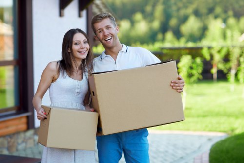 Relocation specialists organizing boxes for an Italian move