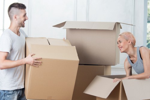 Professional movers loading household furniture for a relocation in Italy