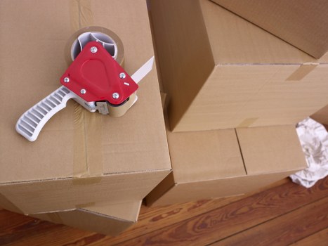 Packed household boxes and furniture ready for transport in Italy