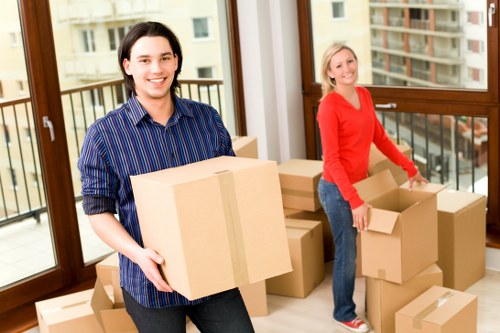 Packing and loading furniture into a truck in an Italian city